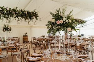 clearspan marquee flat linings. fairy lightings in roof. rustic round tables